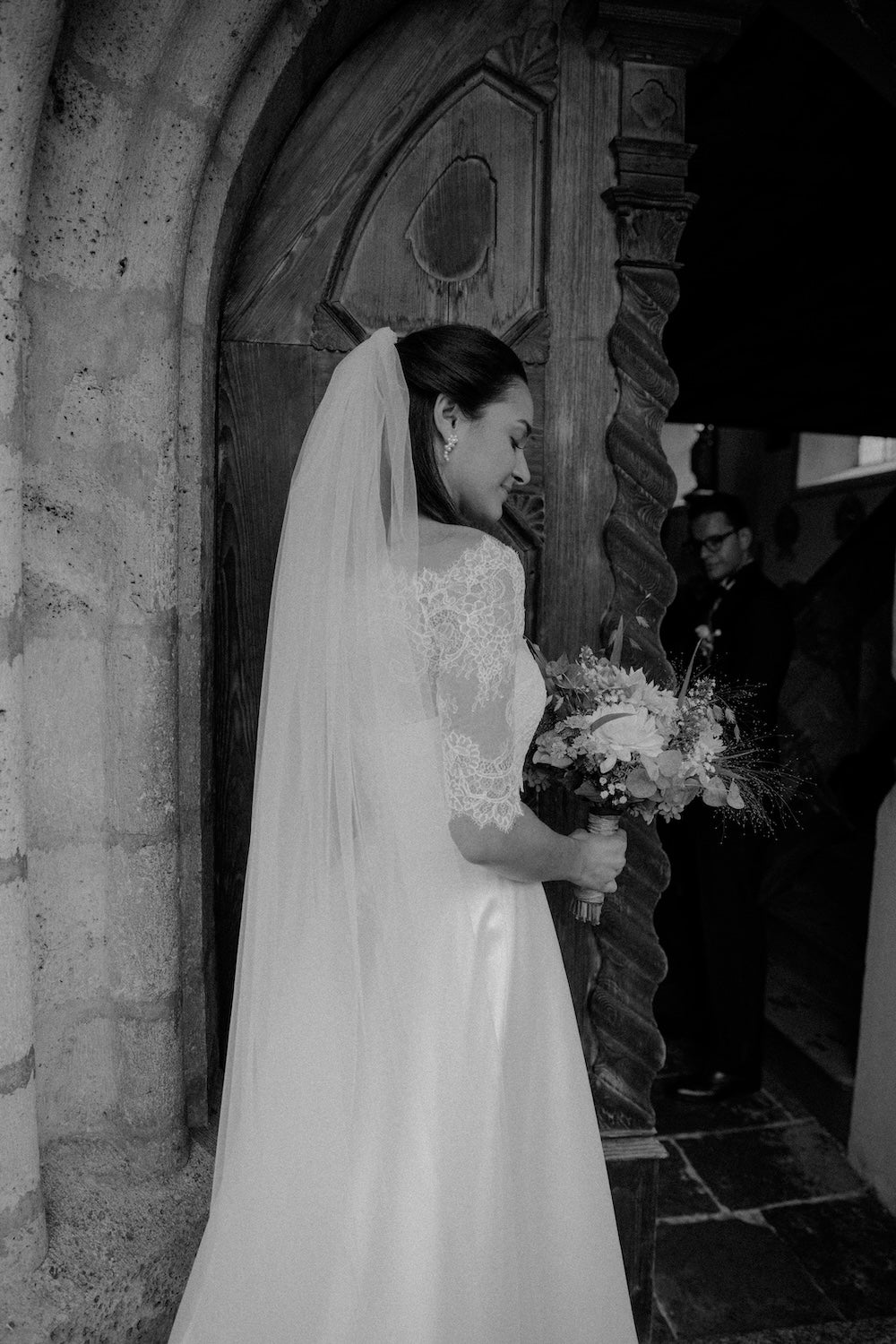 woman in white dress with pearl earrings